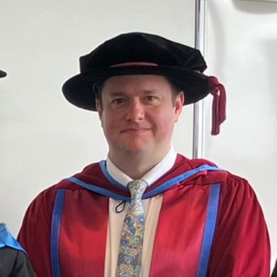 Head and shoulders photo of Richard Bowyer, dressed in graduation outfit