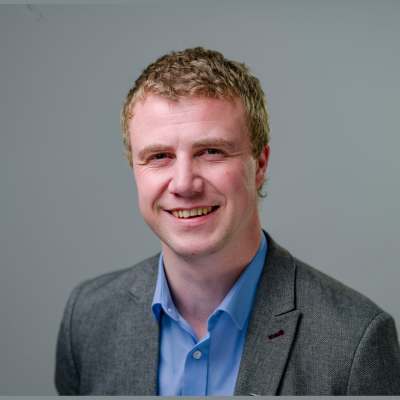 a head and shoulders photo of Mark Plummer